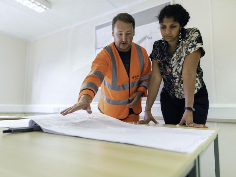 Technical team in meeting with project documents